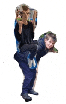 a man is carrying a child on his back