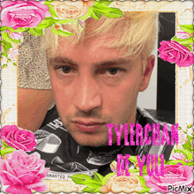 a picture of a man surrounded by pink roses and the words tylerchan on it