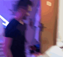a blurry picture of a person standing in a room