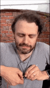 a man with a beard and a ring on his finger