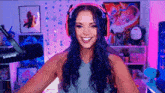 a woman wearing headphones and a shure microphone
