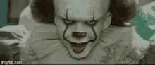 a close up of pennywise the clown from it chapter two making a funny face .