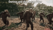 a group of chimpanzees are dancing in the dirt with the words denise und die naturgötter above them