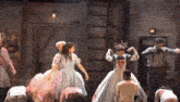 a group of people are dancing in front of a sign that says " building "