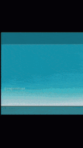 a couple of hands holding each other on a blue background