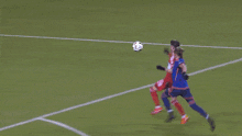 a soccer game is being played in front of a banner that says westrus