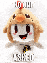 a stuffed animal wearing a chicken hat with the words no one asked