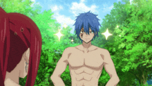a man with blue hair and a tattoo on his face is standing next to a woman with red hair