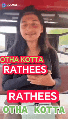 a woman is smiling and holding a purse with the words " rathees otha kotta " written on it