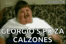 a fat man is sitting on a couch with the words `` georgia 's pizza calzones '' written on his face .