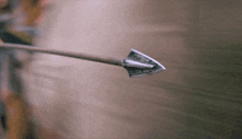 a close up of an arrow pointing at a target .