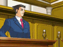a man in a suit and tie stands behind a podium