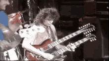 Jimmy Page Zeppelin GIF - Jimmy Page Zeppelin Double Neck GIFs