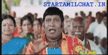 a man stands in front of a crowd with the words startamilchat in the bottom right corner