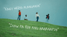 a group of people standing on top of a grassy hill with the words " kahit medyo alangarin " written above them
