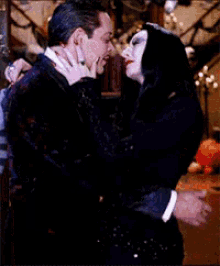 Morticia Gomez Addams GIF - Morticia Gomez Addams Kiss GIFs