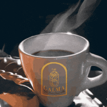 a cup of coffee with a label that says calma