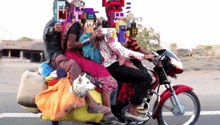 a group of people are riding a motorcycle with a dog on the back of it
