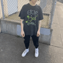 a person wearing a black shirt that says huf