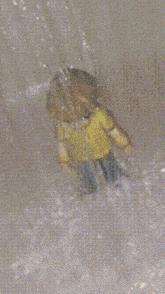 a cartoon character in a yellow shirt and blue jeans
