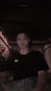 a person wearing a black shirt that says jun 2