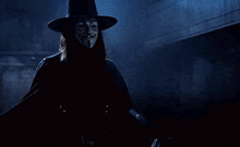 a man wearing a mask and a hat is holding two knives