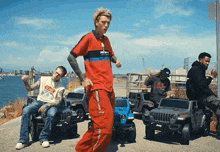 a man in a red shirt with the word puma on it is dancing