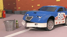 a blue and white race car with the number 88 on it