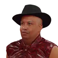 a man wearing a black hat and a red shirt