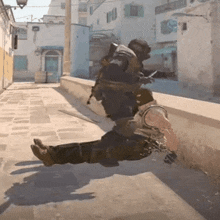 a man in a military uniform is laying on the ground with his legs crossed