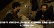 two men sitting next to each other with the words " sen niye yalan soyluyorsun " on the bottom