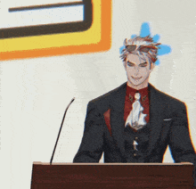 a man in a suit is giving a speech