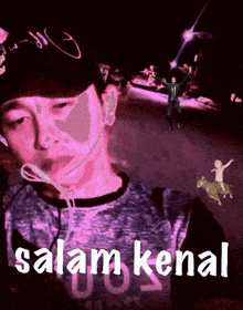 a man wearing headphones says salam kenal