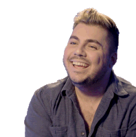 a man with a beard and a blue shirt smiles