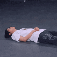 a person is laying on the floor with their hands on their hips