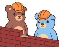 two teddy bears wearing hard hats are standing next to a brick wall