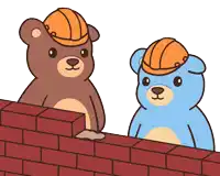 two teddy bears wearing hard hats are standing next to a brick wall