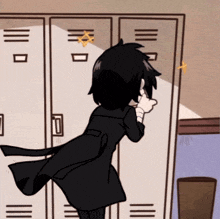 a person in a black coat is standing in front of a locker