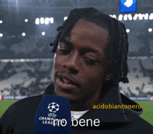 a man talking into a microphone that says champions league