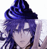a man with long purple hair is giving a peace sign next to a cupcake with blue frosting