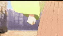 a close up of a person 's hand holding another person 's fist .