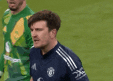 a soccer player wearing a jersey that says dxc on the sleeve