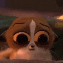 a close up of a cartoon cat with big eyes and a sad look on its face .