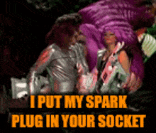 a picture of a man and a woman with the words " i put my spark plug in your socket " above them