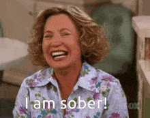 a woman is laughing and says `` i am sober '' .