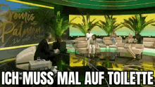 a group of people are sitting on a couch in a room with palm trees on the wall .