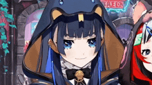 a girl in a snake costume is smiling in front of a sign that says ' baelz '