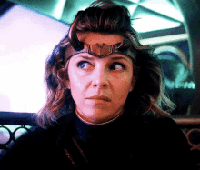 a woman wearing a helmet with horns on her head