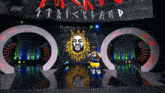 a wrestler stands in front of a large screen that says strikeland