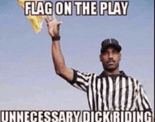 a referee in a striped shirt is holding up a yellow flag .